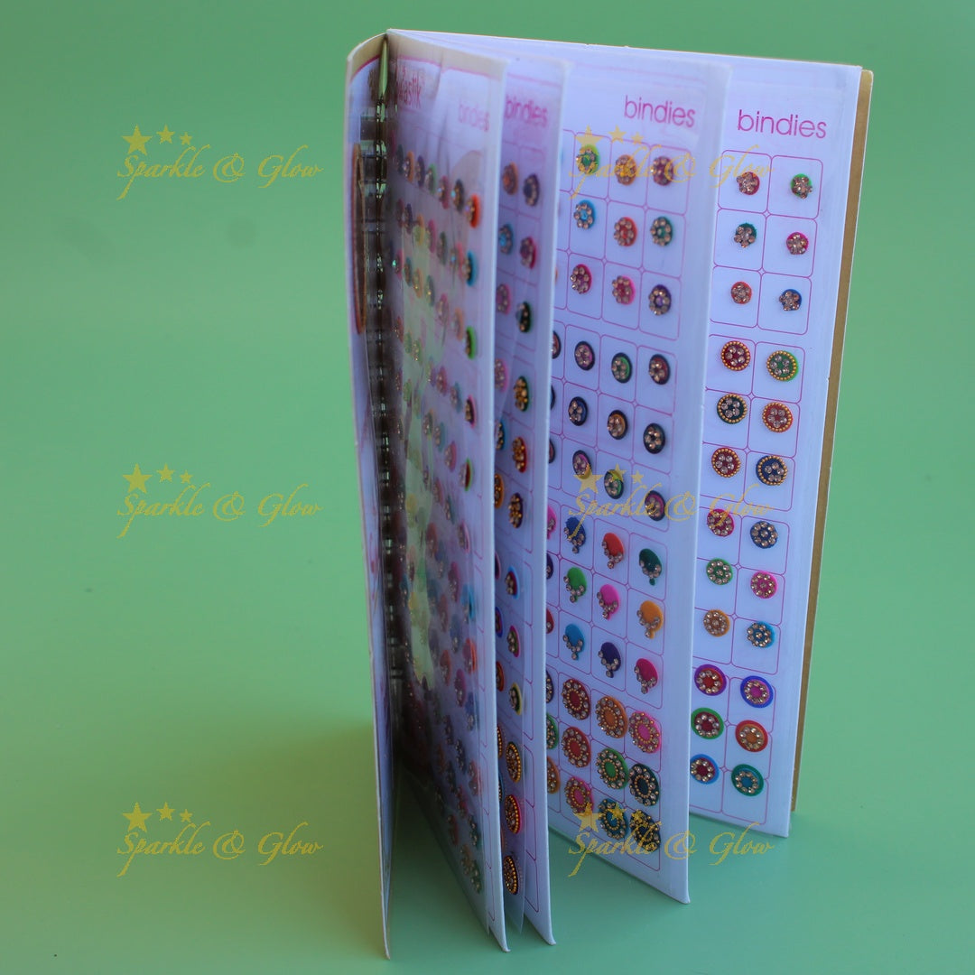 Swastik stone bindi with different shape and size in spiral book in assorted colours