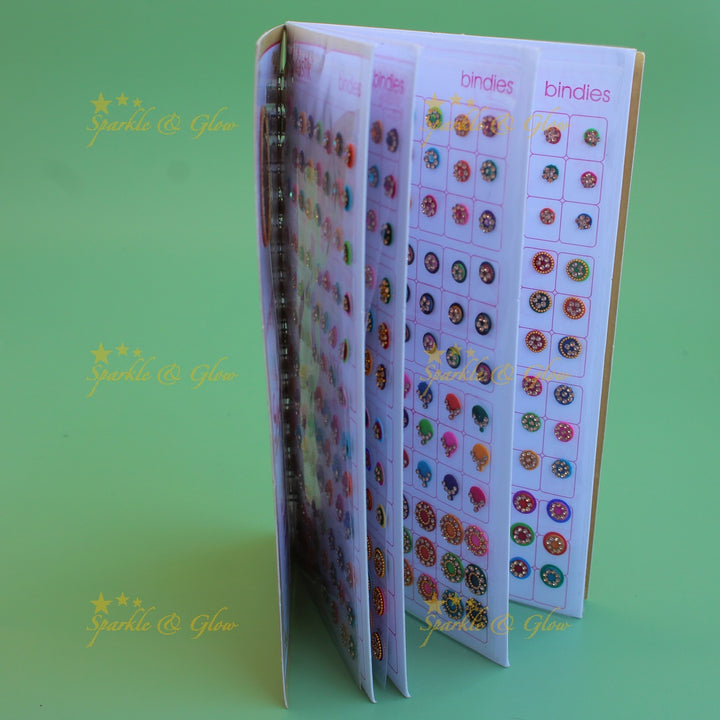 Swastik stone bindi with different shape and size in spiral book in assorted colours