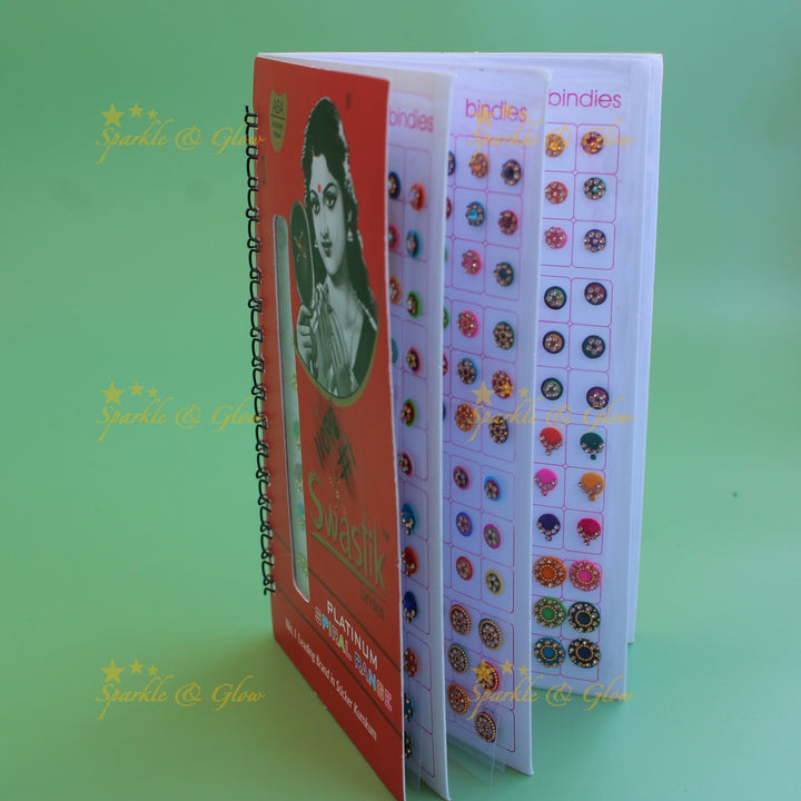 Swastik stone bindi with different shape and size in spiral book in assorted colours