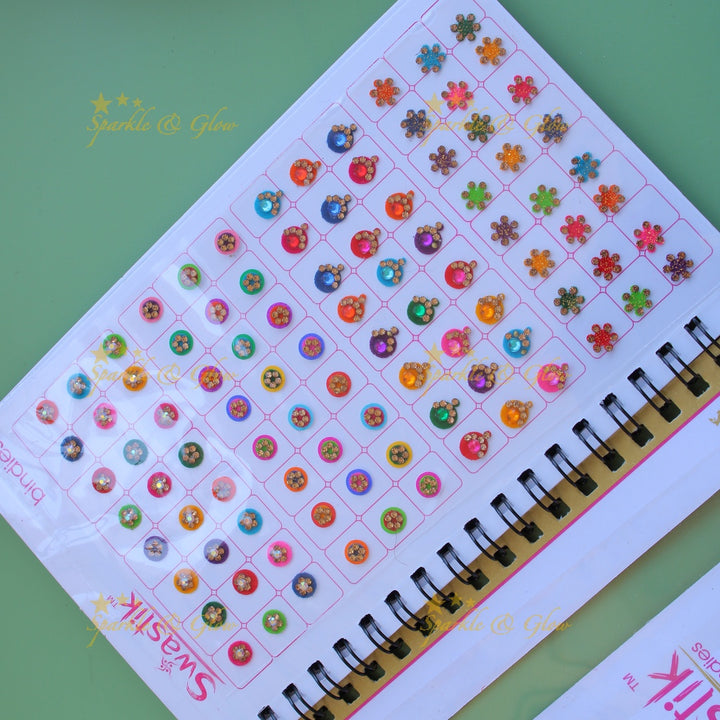 Swastik stone bindi with different shape and size in spiral book in assorted colours