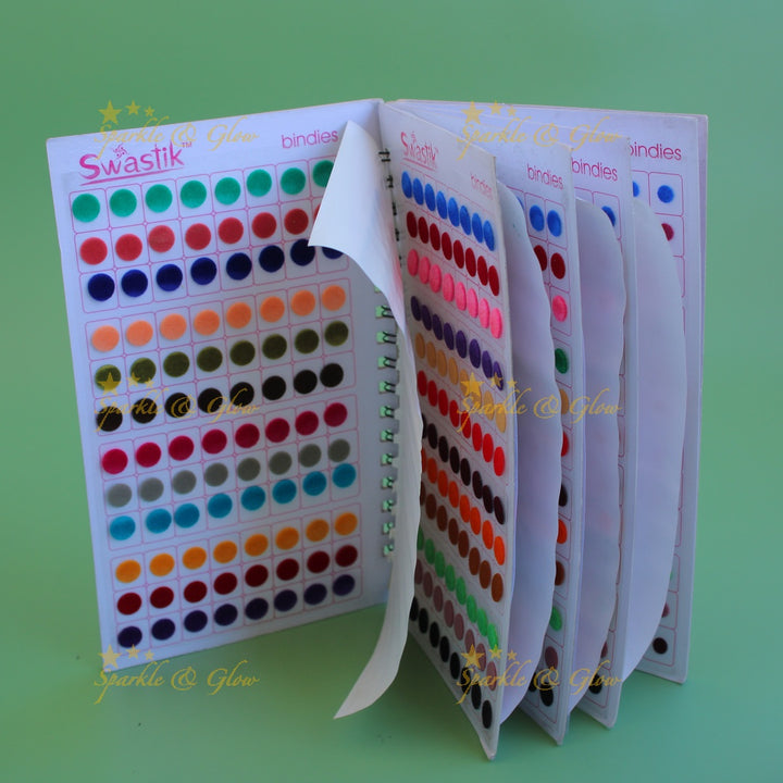 Swastik round stone and plain bindi with different size in spiral book in assorted colours