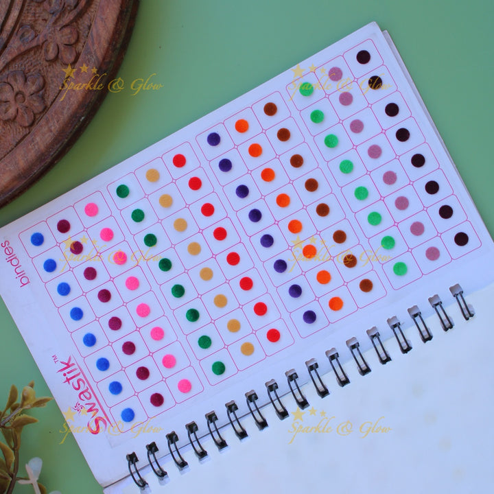 Swastik round stone and plain bindi with different size in spiral book in assorted colours