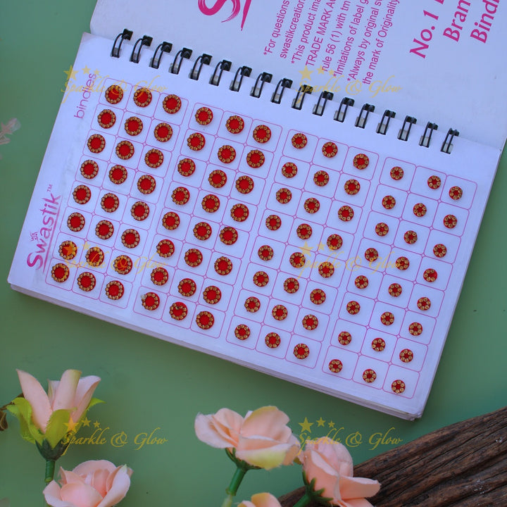 Swastik round stone and plain bindi with different size in spiral book in assorted colours
