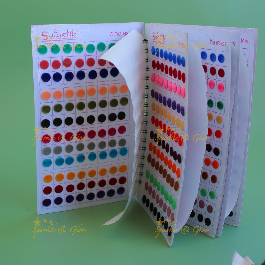 Swastik round stone and plain bindi with different size in spiral book in assorted colours