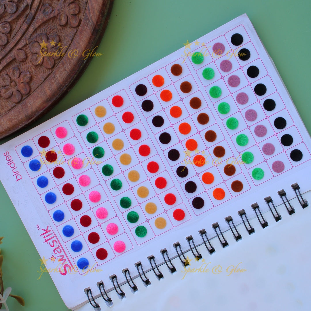 Swastik round stone and plain bindi with different size in spiral book in assorted colours