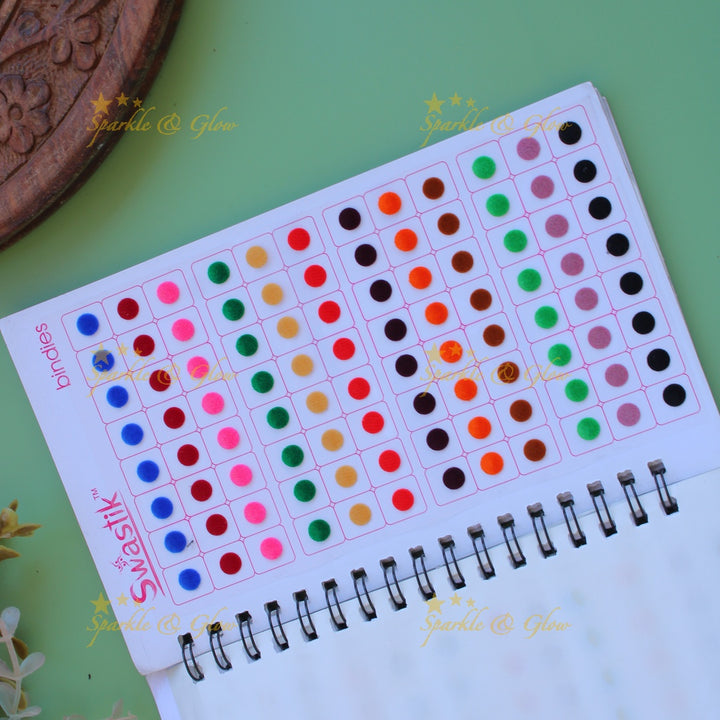 Swastik round stone and plain bindi with different size in spiral book in assorted colours