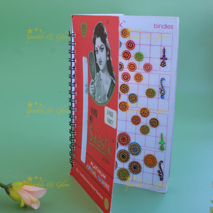 Swastik bridal stone bindi with different shape and size in spiral book in assorted colours
