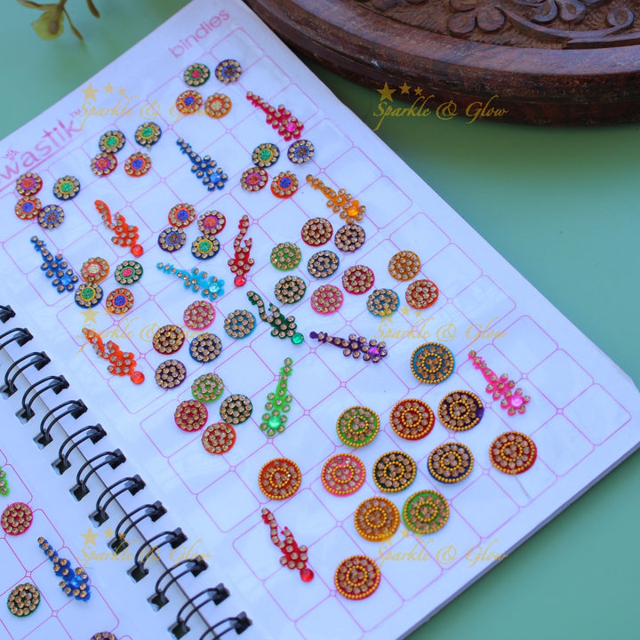 Swastik bridal stone bindi with different shape and size in spiral book in assorted colours