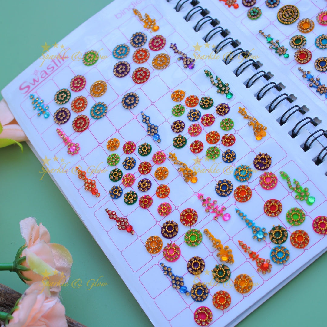 Swastik bridal stone bindi with different shape and size in spiral book in assorted colours