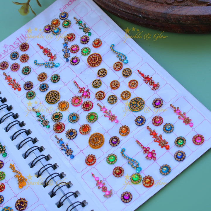 Swastik bridal stone bindi with different shape and size in spiral book in assorted colours