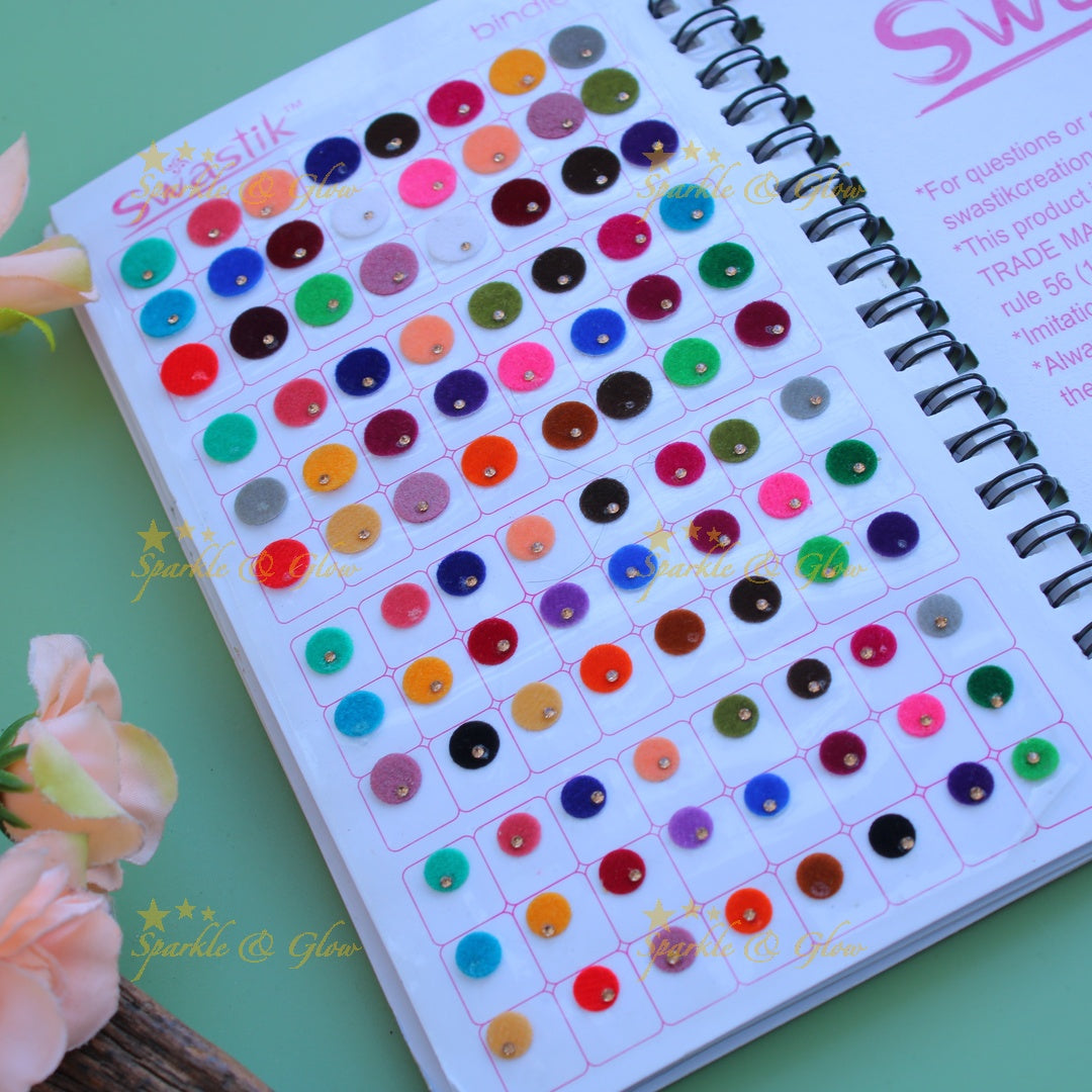 Swastik bridal stone bindi with different shape and size in spiral book in assorted colours
