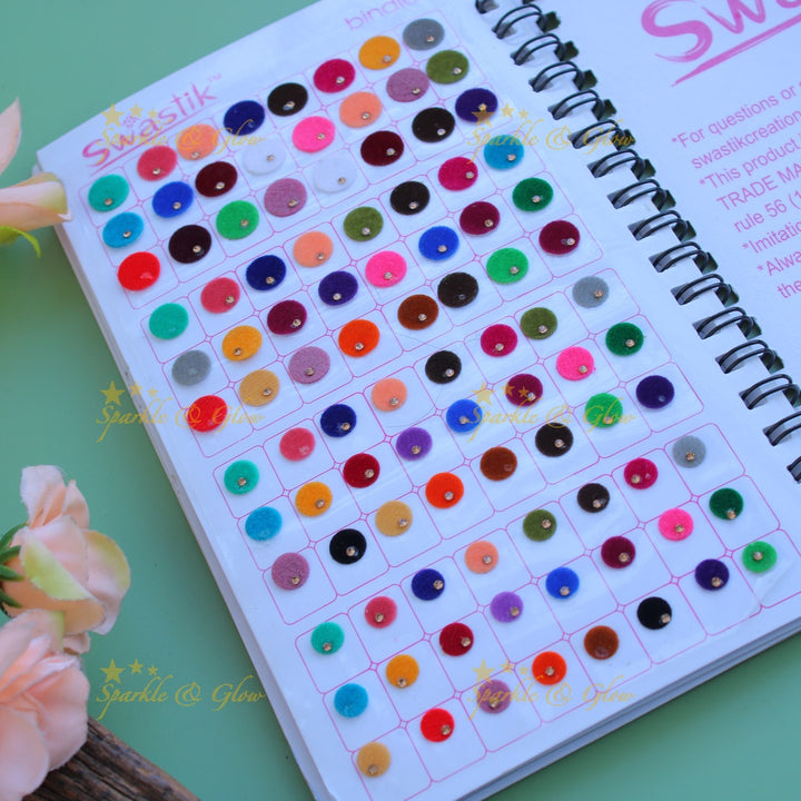 Swastik bridal stone bindi with different shape and size in spiral book in assorted colours