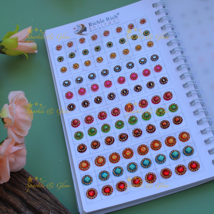 Richie Rich round single stone and different design bindi with different size in spiral book in assorted colours