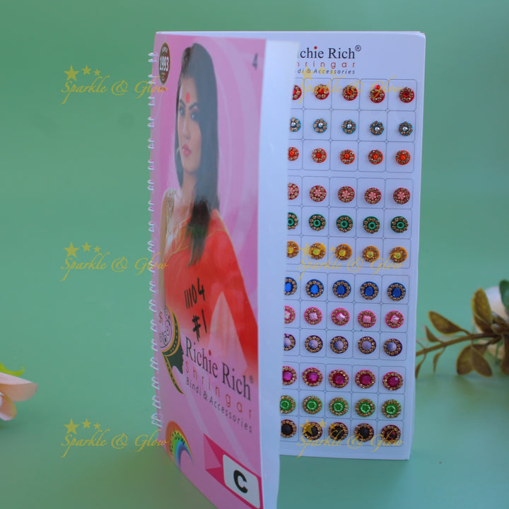 Richie Rich round single stone and different design bindi with different size in spiral book in assorted colours