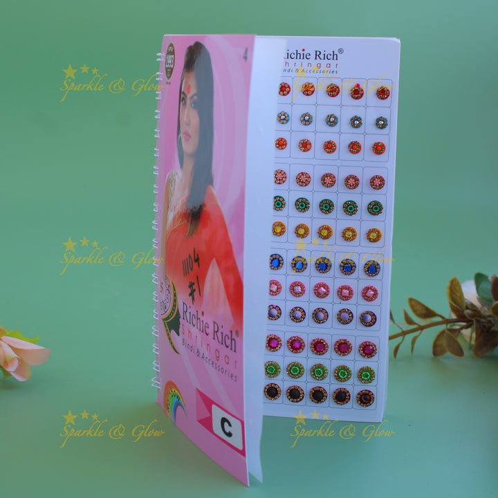 Richie Rich round single stone and different design bindi with different size in spiral book in assorted colours