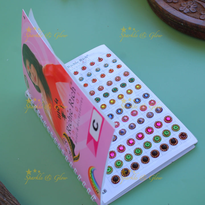 Richie Rich round single stone and different design bindi with different size in spiral book in assorted colours