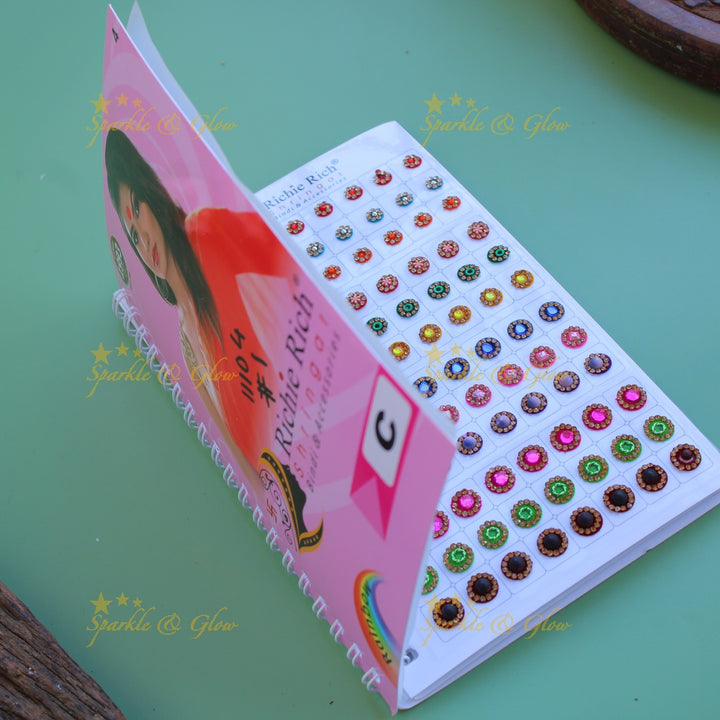 Richie Rich round single stone and different design bindi with different size in spiral book in assorted colours