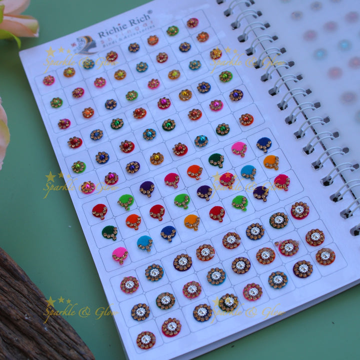 Richie Rich round single stone and different design bindi with different size in spiral book in assorted colours