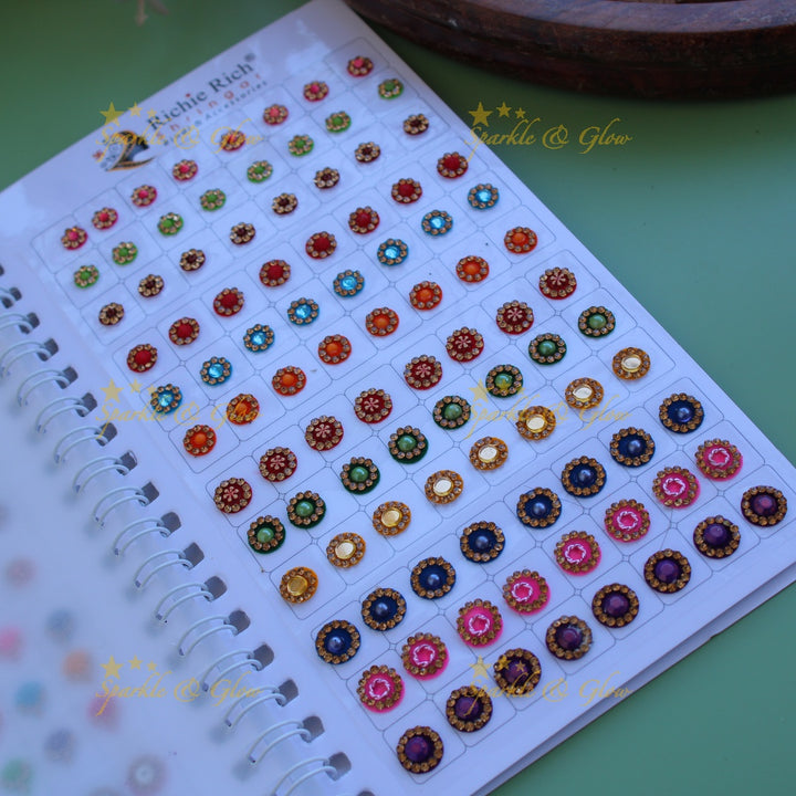 Richie Rich round single stone and different design bindi with different size in spiral book in assorted colours