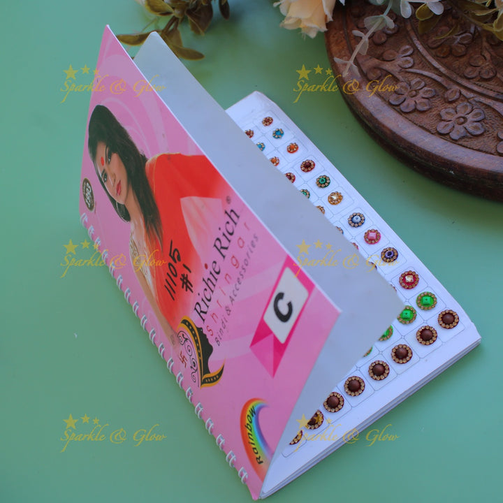 Richie Rich round stone gold bead and 3D design bindi with different size in spiral book in assorted colours