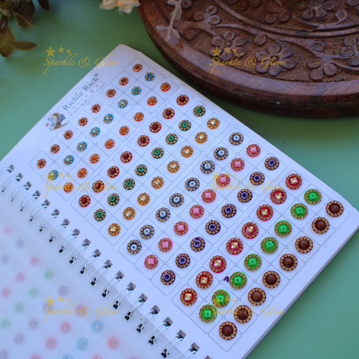 Richie Rich round stone gold bead and 3D design bindi with different size in spiral book in assorted colours