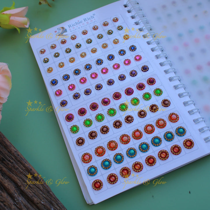 Richie Rich round stone and 3D design bindi with different size in spiral book in assorted colours