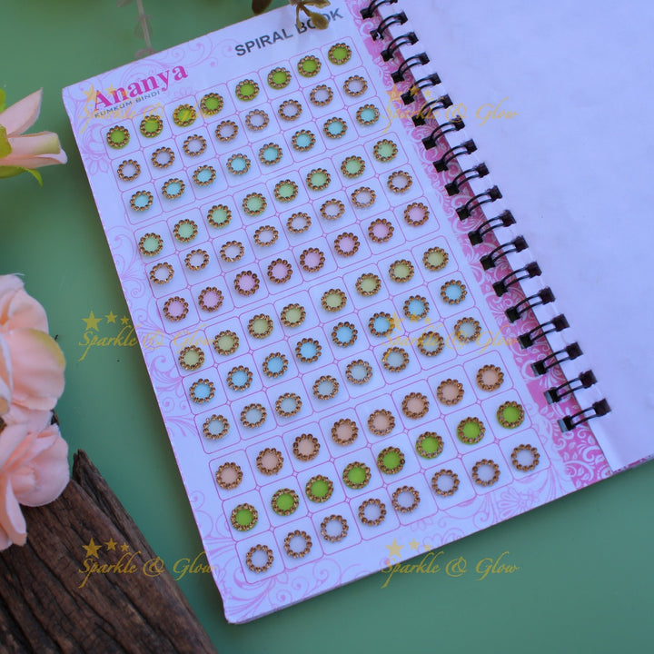 Ananya round stone bindi with different size in spiral book in pastel colours