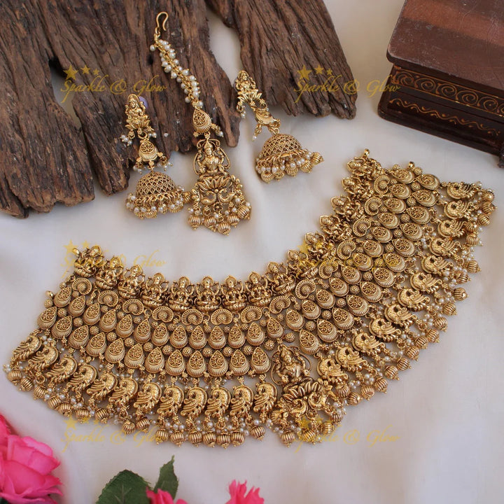Grand intricate Lakshmi peacock bridal choker with green beads with maang tikka - Sparkle and Glow