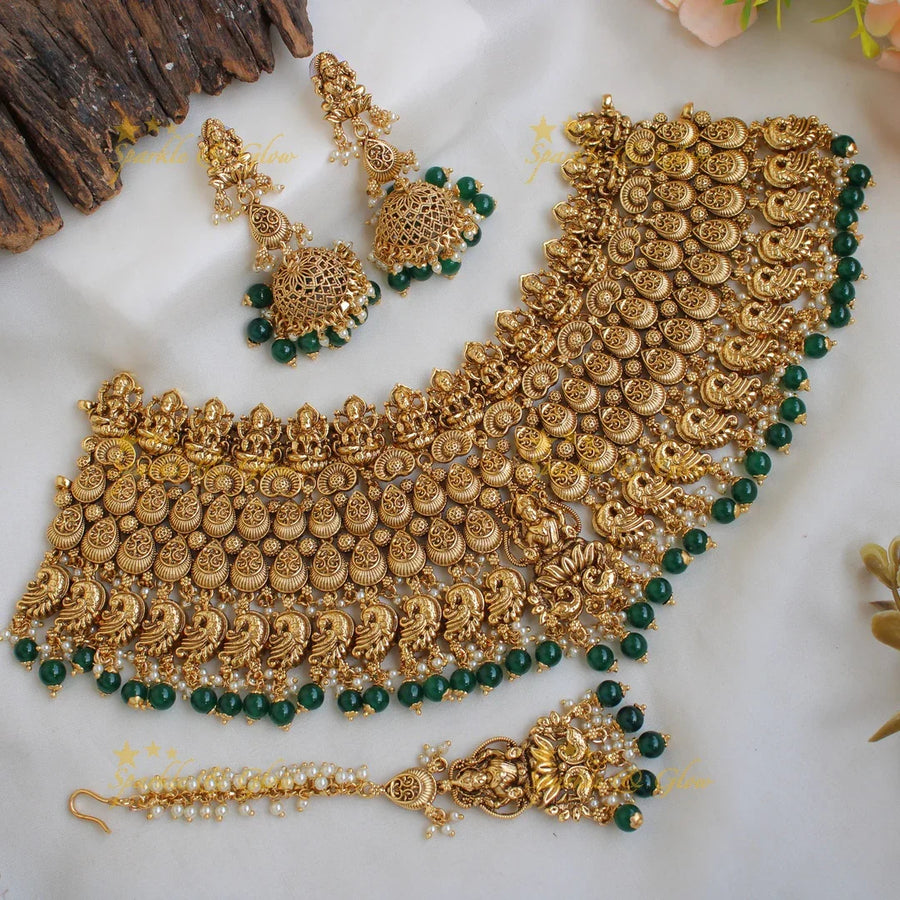 Grand intricate Lakshmi peacock bridal choker with green beads with maang tikka - Sparkle and Glow