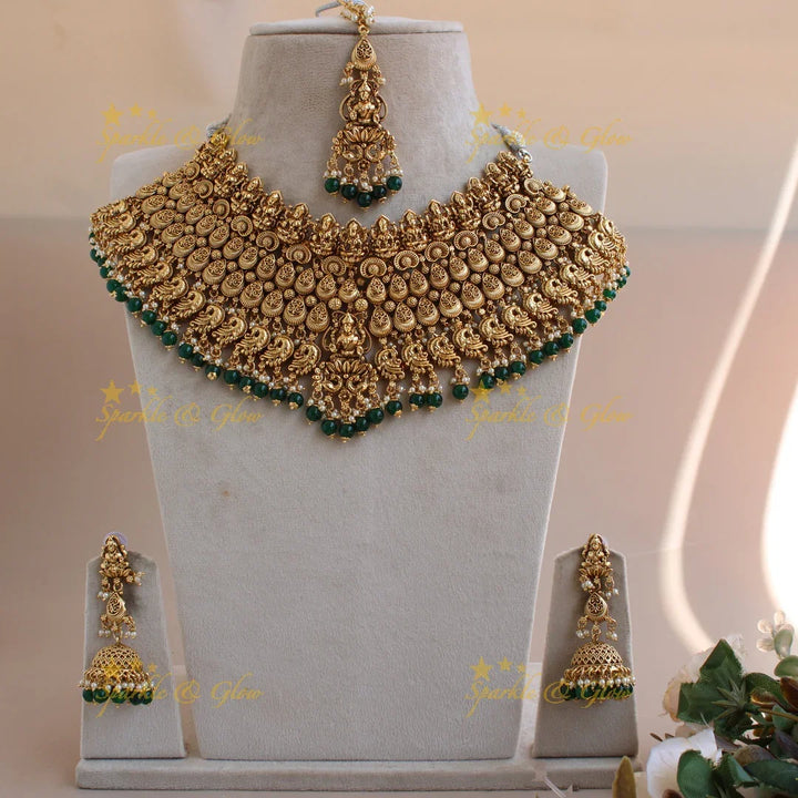 Grand intricate Lakshmi peacock bridal choker with green beads with maang tikka - Sparkle and Glow