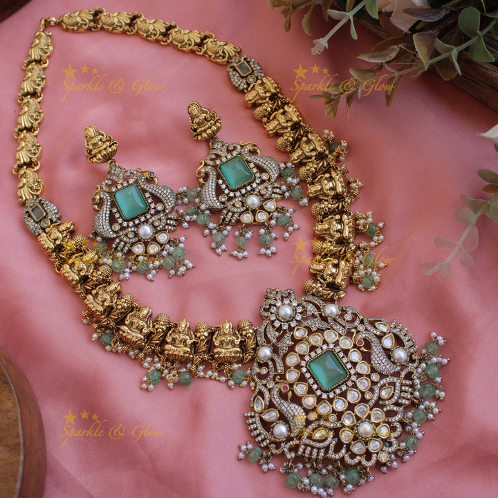 Grand intricate Lakshmi Peacock carved dual tone Victorian AD long necklace with mint green beads and red stones