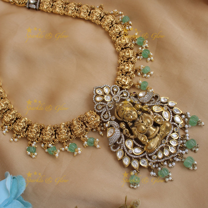 Exclusive Lakshmi Peacock flower carved dual tone Victorian AD long necklace with mint green beads