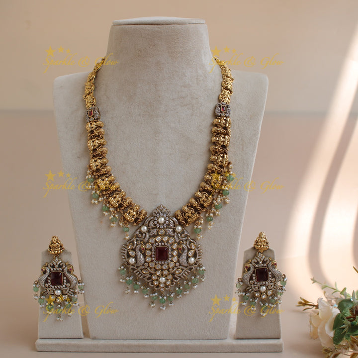 Grand intricate Lakshmi Peacock carved dual tone Victorian AD long necklace with mint green beads and red stones