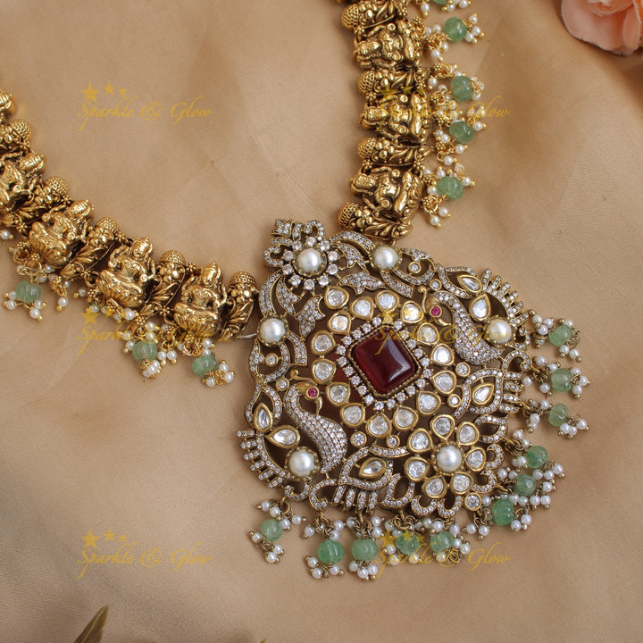 Grand intricate Lakshmi Peacock carved dual tone Victorian AD long necklace with mint green beads and red stones