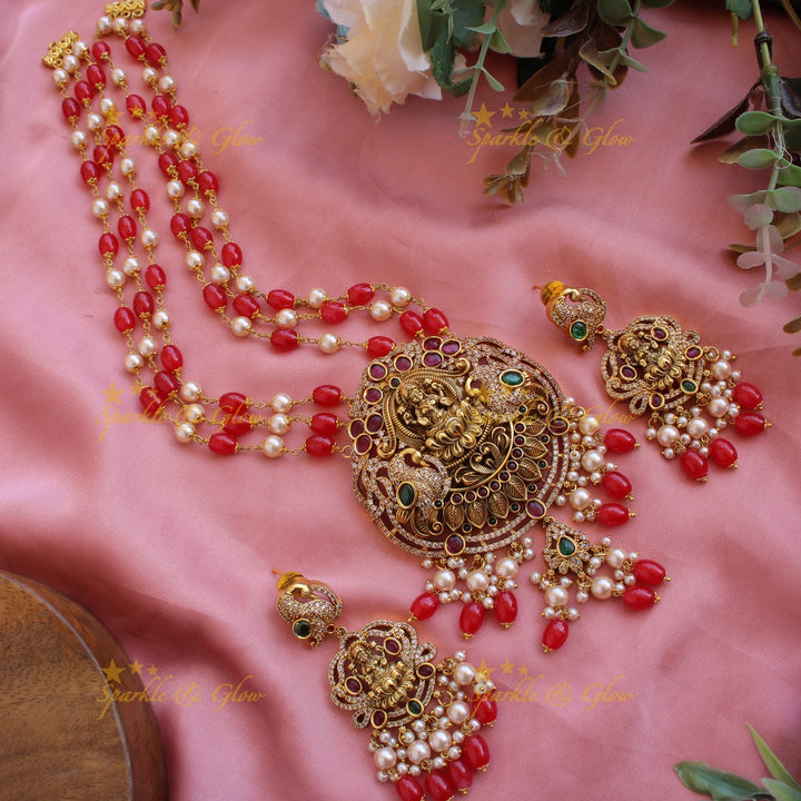Beautiful Lakshmi peacock CZ stone pendant Victorian AD haram with three layer pearl and red beads chain