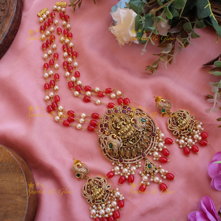 Beautiful Lakshmi peacock CZ stone pendant Victorian AD haram with three layer pearl and red beads chain