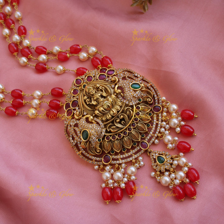 Beautiful Lakshmi peacock CZ stone pendant Victorian AD haram with three layer pearl and red beads chain