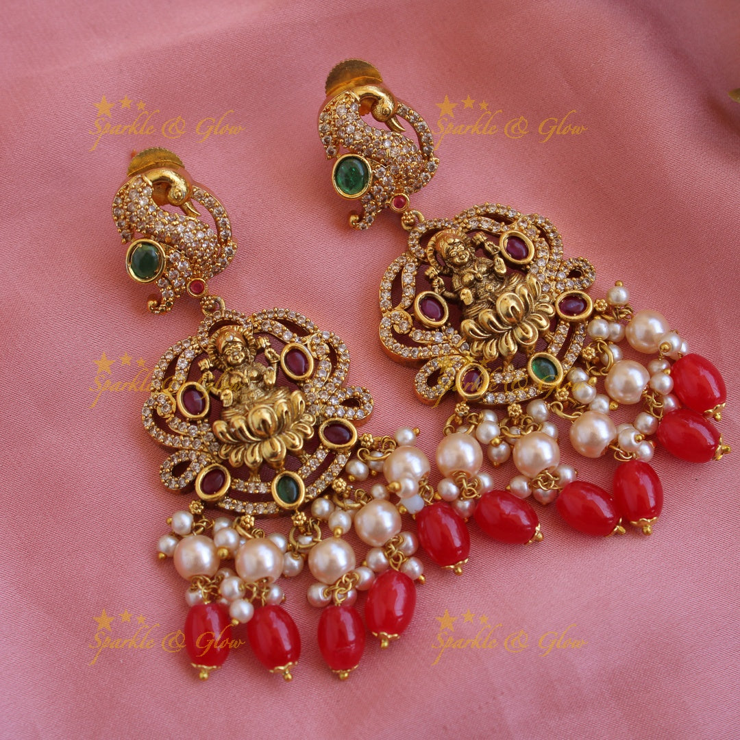 Beautiful Lakshmi peacock CZ stone pendant Victorian AD haram with three layer pearl and red beads chain