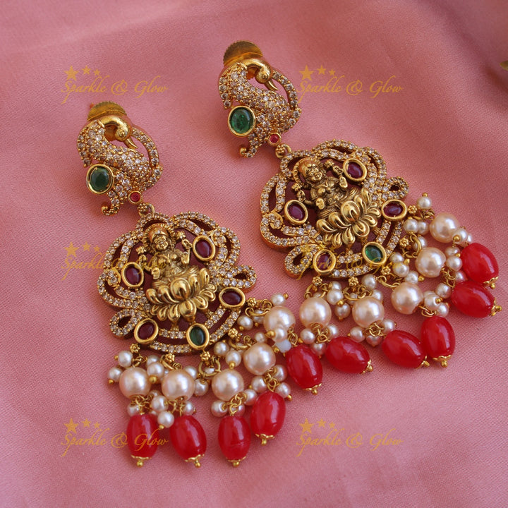 Beautiful Lakshmi peacock CZ stone pendant Victorian AD haram with three layer pearl and red beads chain