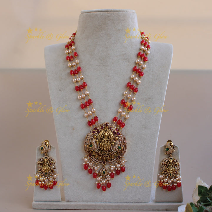 Beautiful Lakshmi peacock CZ stone pendant Victorian AD haram with three layer pearl and red beads chain