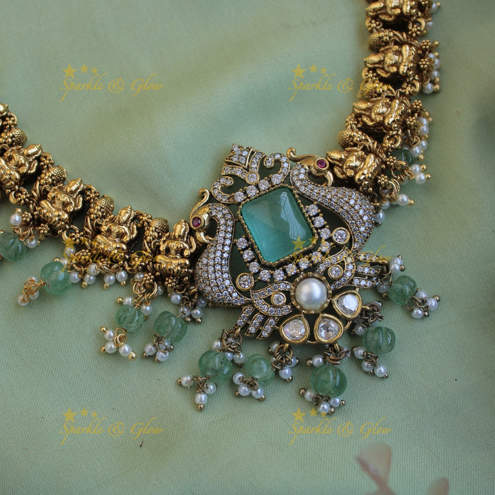 Beautiful Lakshmi Peacock design dual tone victorian AD short necklace with mint green beads and stones