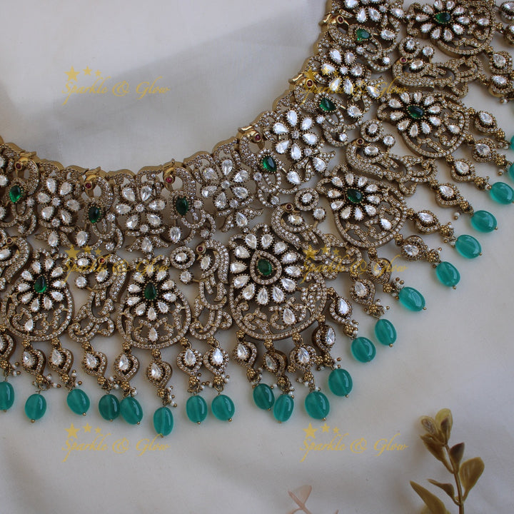 Gorgeous Bridal peacock floral design Victorian AD choker with emerald and green beads with maang tikka