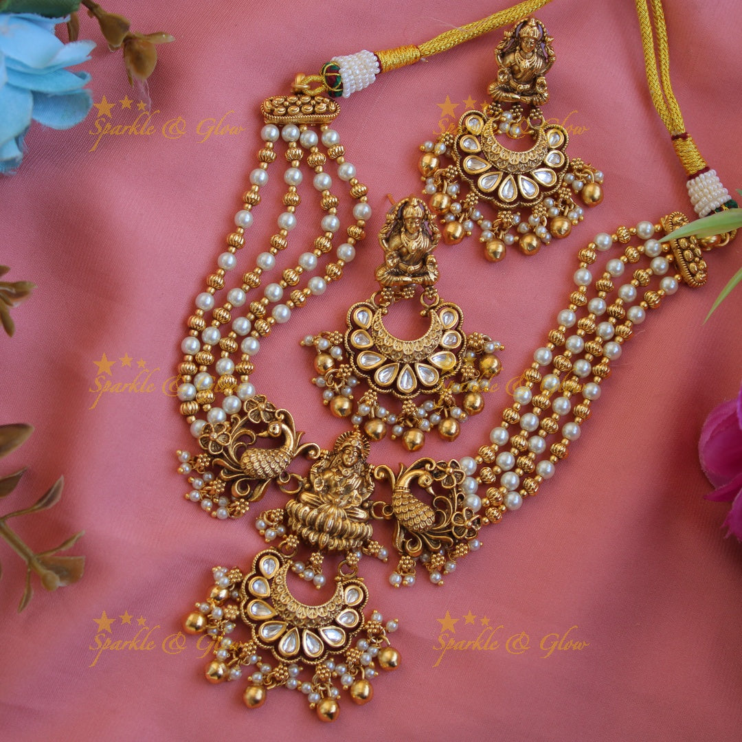 Elegant Lakshmi peacock carved jadau short necklace with gold beads and pearls - white1