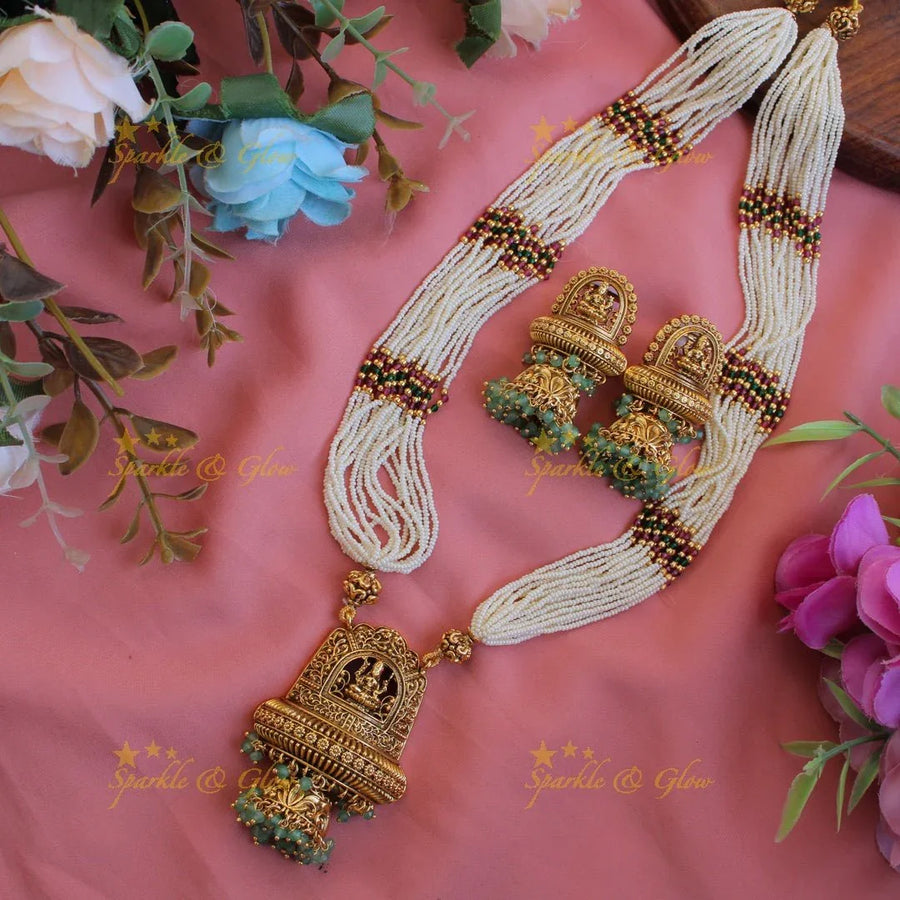 Beautiful Lakshmi flower carved pendant haram with multi layer pearl chain and mint green beads - Sparkle and Glow