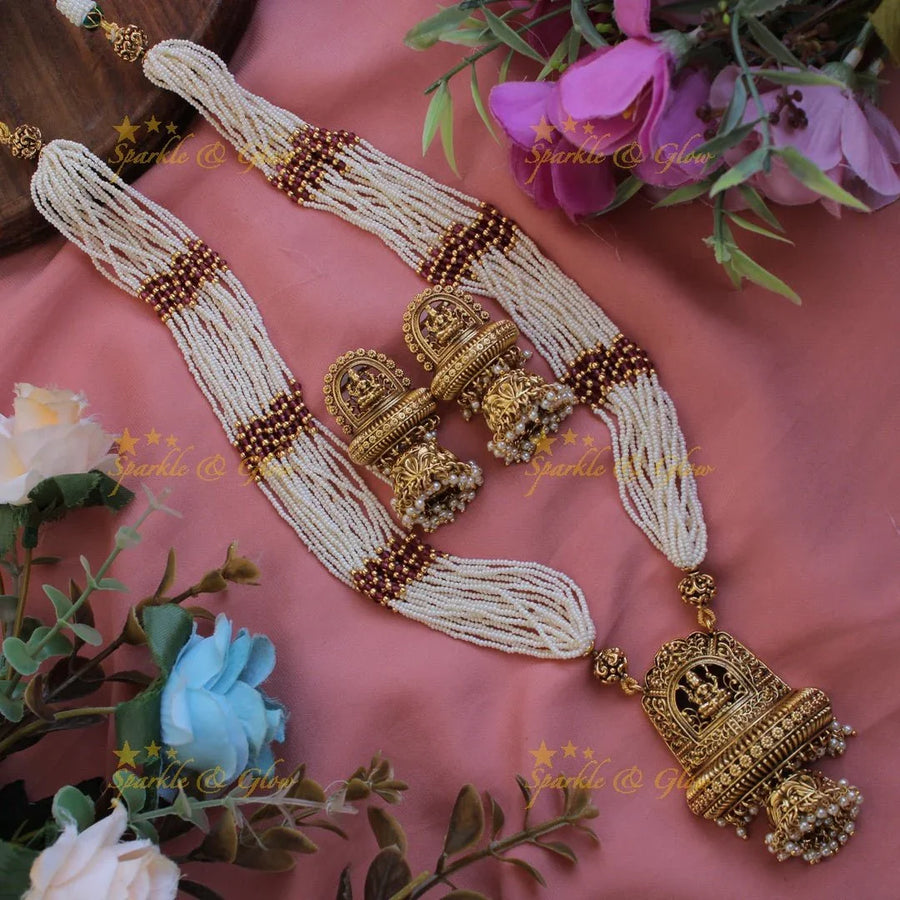 Beautiful Lakshmi flower carved pendant haram with multi layer pearl chain and pearl drops - Sparkle and Glow