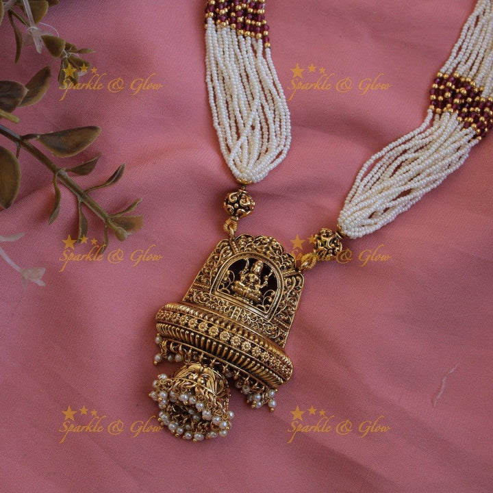 Beautiful Lakshmi flower carved pendant haram with multi layer pearl chain and pearl drops - Sparkle and Glow
