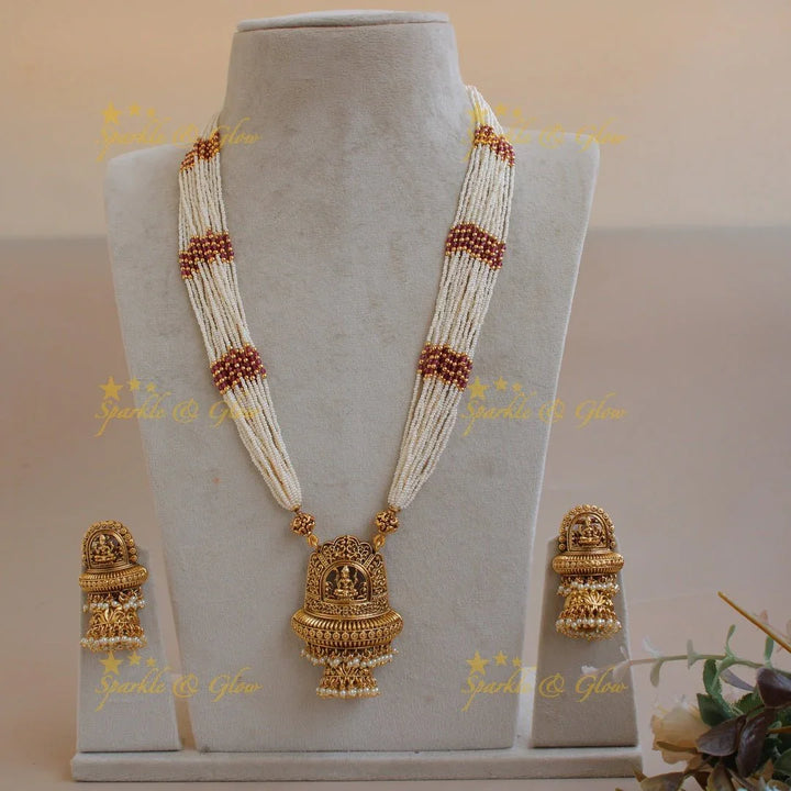 Beautiful Lakshmi flower carved pendant haram with multi layer pearl chain and pearl drops - Sparkle and Glow