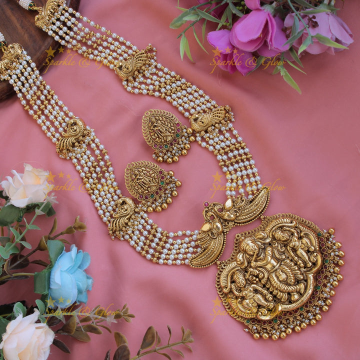 Gorgeous Krishna playing flute and peacock carved haram with multi layer gold and red beads chain