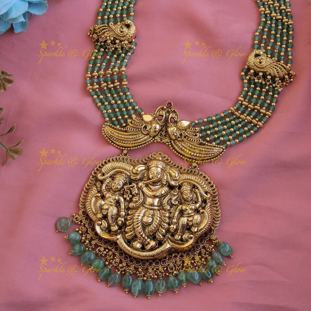 Gorgeous Krishna playing flute and peacock carved haram with multi layer gold and maroon beads chain - Sparkle and Glow - Mintgreen - Back Thread