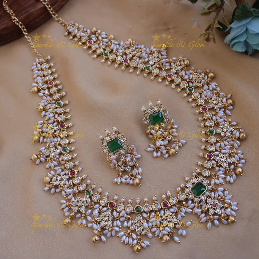 Exclusive floral design gutta pusalu long necklace with ruby emerald white stones and rice pealrs - Sparkle and Glow